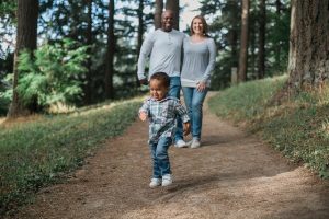 family walking in woods